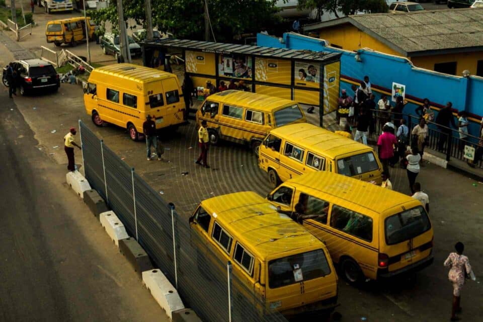 Yellow buses in Nigeria in the middle of the street during rush hour