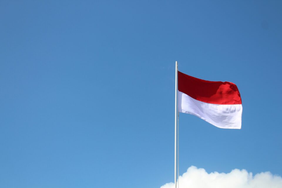 Indonesian flag flying above a cloud